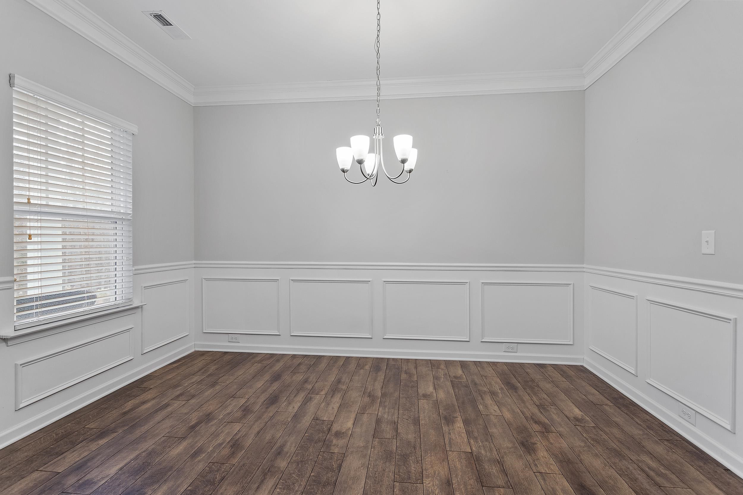 306 Springhill Lane Garner, NC 27529 - Photo 8 of 34 a view of a room with wooden floor and window