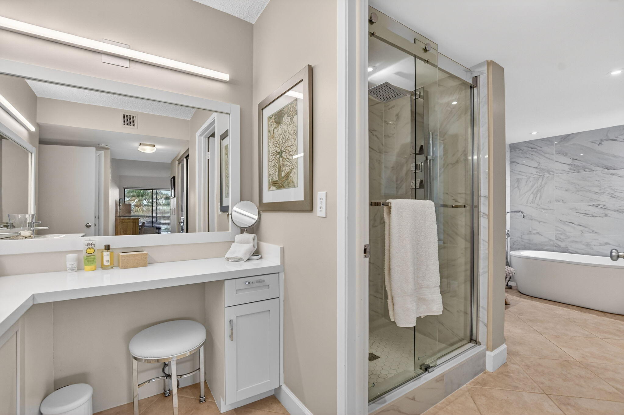 5851 Camino Del Sol, Unit 402 Boca Raton, FL 33433 - Photo 25 of 40 a bathroom with a shower sink and mirror