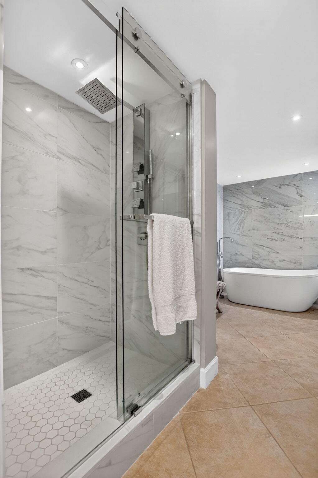 5851 Camino Del Sol, Unit 402 Boca Raton, FL 33433 - Photo 26 of 40 a bathroom with a glass shower door and a sink