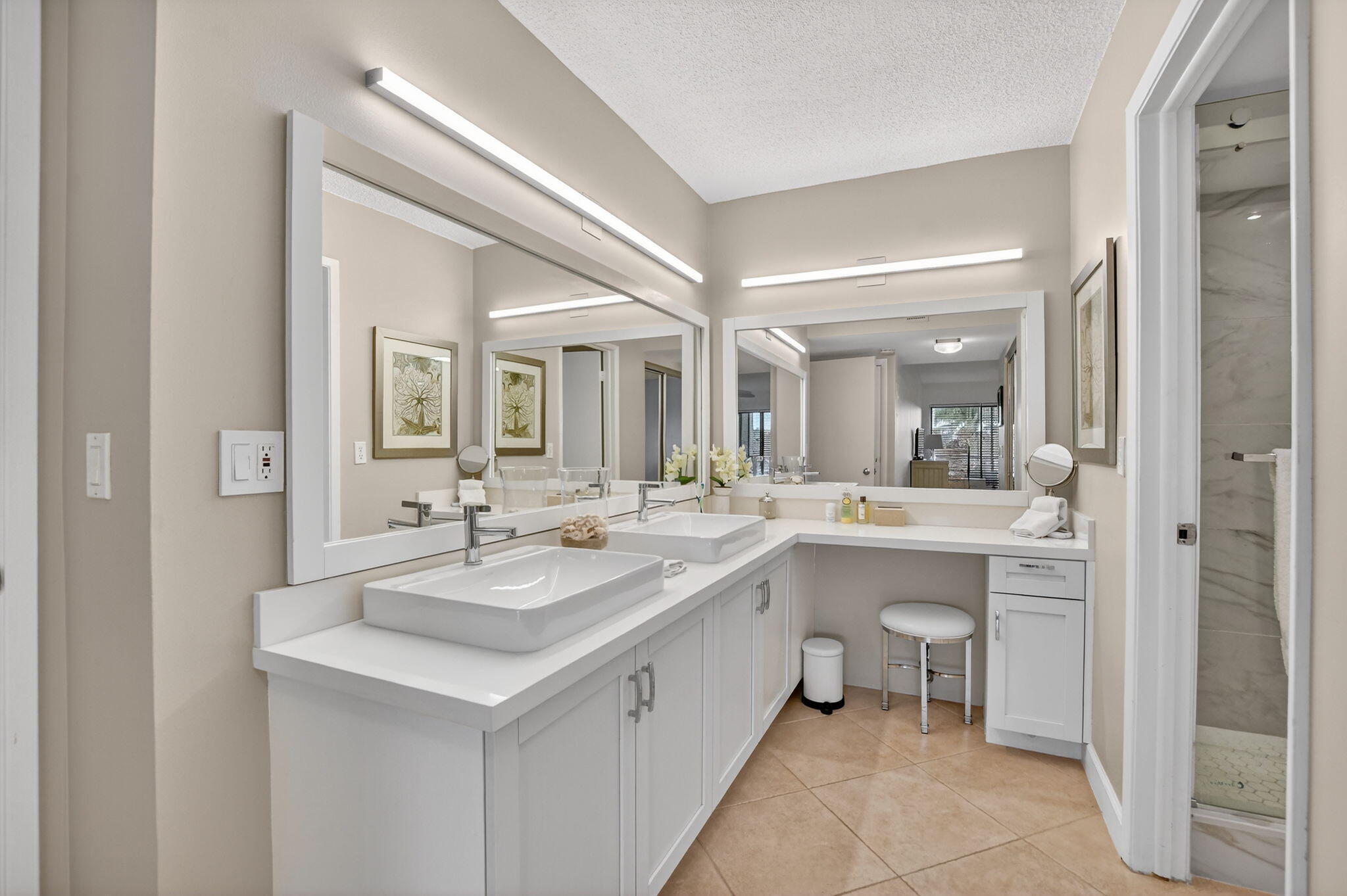 5851 Camino Del Sol, Unit 402 Boca Raton, FL 33433 - Photo 29 of 40 a bathroom with a sink and a mirror