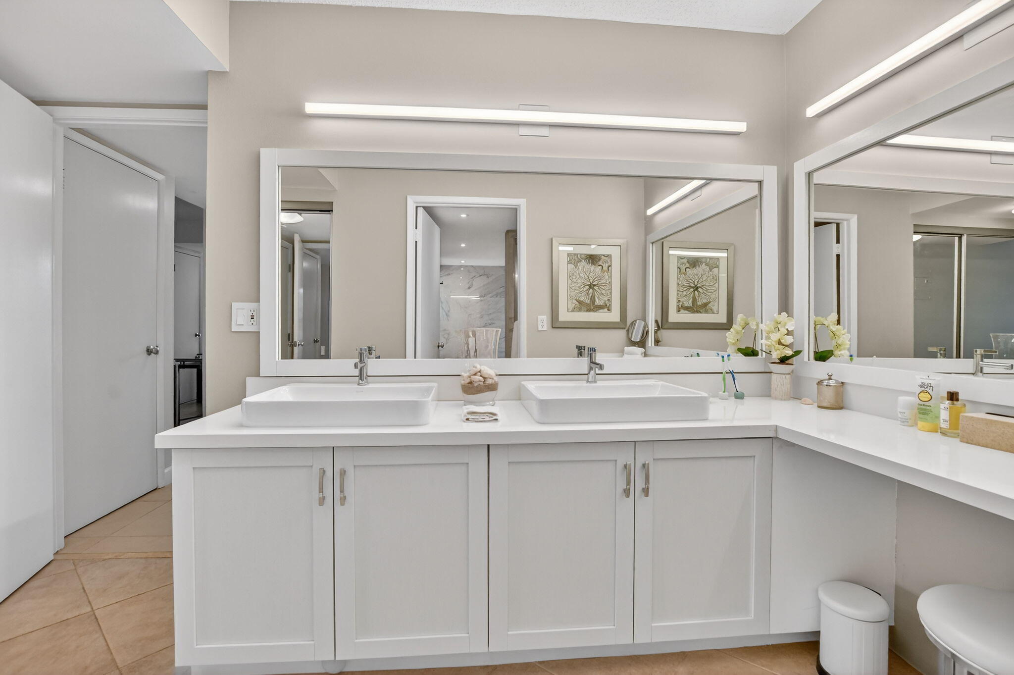 5851 Camino Del Sol, Unit 402 Boca Raton, FL 33433 - Photo 30 of 40 a bathroom with a sink and a mirror