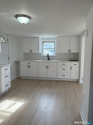 a kitchen with cabinets a sink and dishwasher