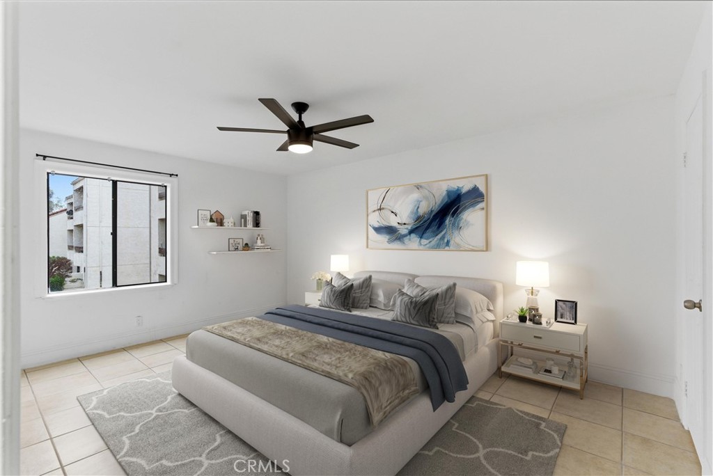 600 West 3rd Street, Unit A210 Santa Ana, CA 92701 - Photo 11 of 30 a bedroom with a large bed and a window