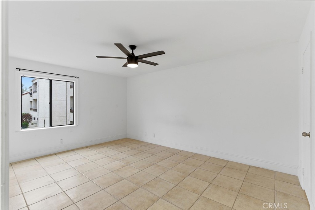 600 West 3rd Street, Unit A210 Santa Ana, CA 92701 - Photo 15 of 30 an empty room with windows and fan