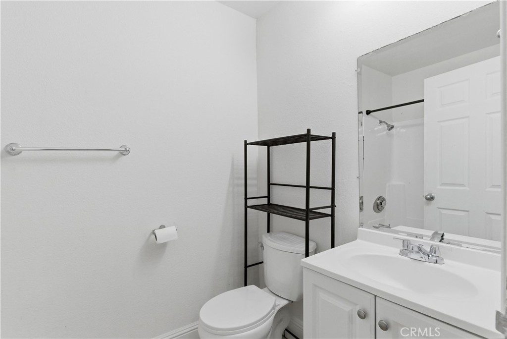 600 West 3rd Street, Unit A210 Santa Ana, CA 92701 - Photo 17 of 30 a bathroom with a sink a toilet and shower