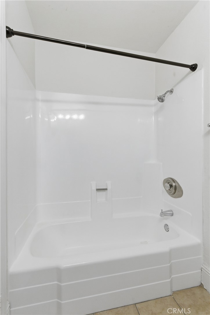 600 West 3rd Street, Unit A210 Santa Ana, CA 92701 - Photo 18 of 30 a bathroom with a shower and a bath tub