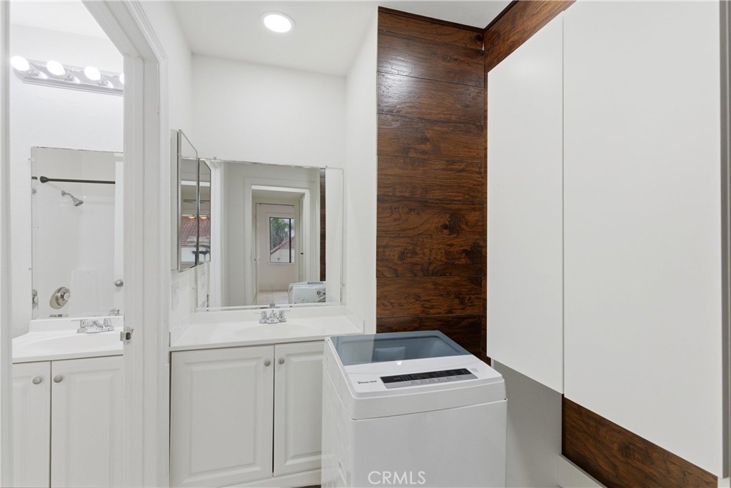 600 West 3rd Street, Unit A210 Santa Ana, CA 92701 - Photo 19 of 30 a bathroom with a sink and a mirror