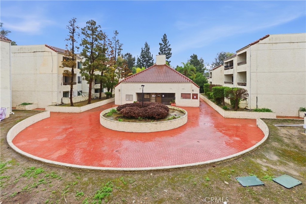 600 West 3rd Street, Unit A210 Santa Ana, CA 92701 - Photo 29 of 30 a view of a swimming pool with a yard in front of it