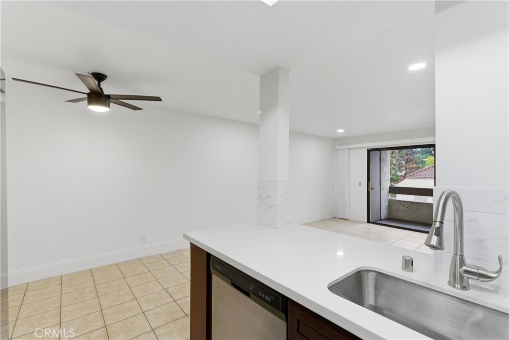 600 West 3rd Street, Unit A210 Santa Ana, CA 92701 - Photo 7 of 30 a kitchen with a sink and a window
