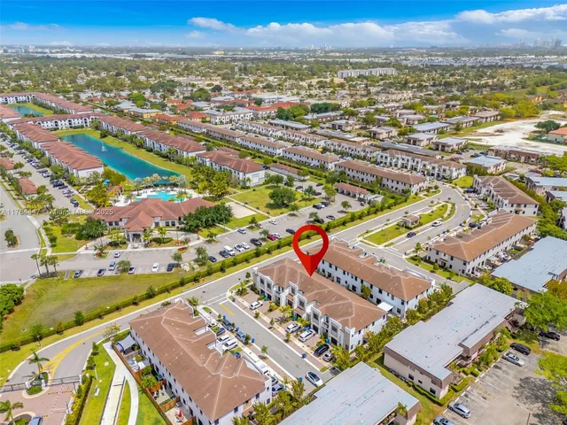 an aerial view of residential building and ocean view