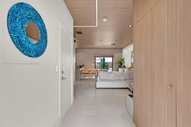 a view of living room with furniture and a painting