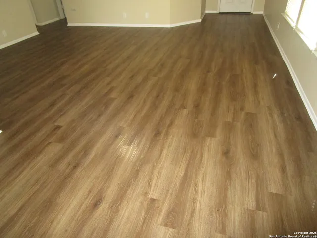 a view of outdoor space with wooden floor