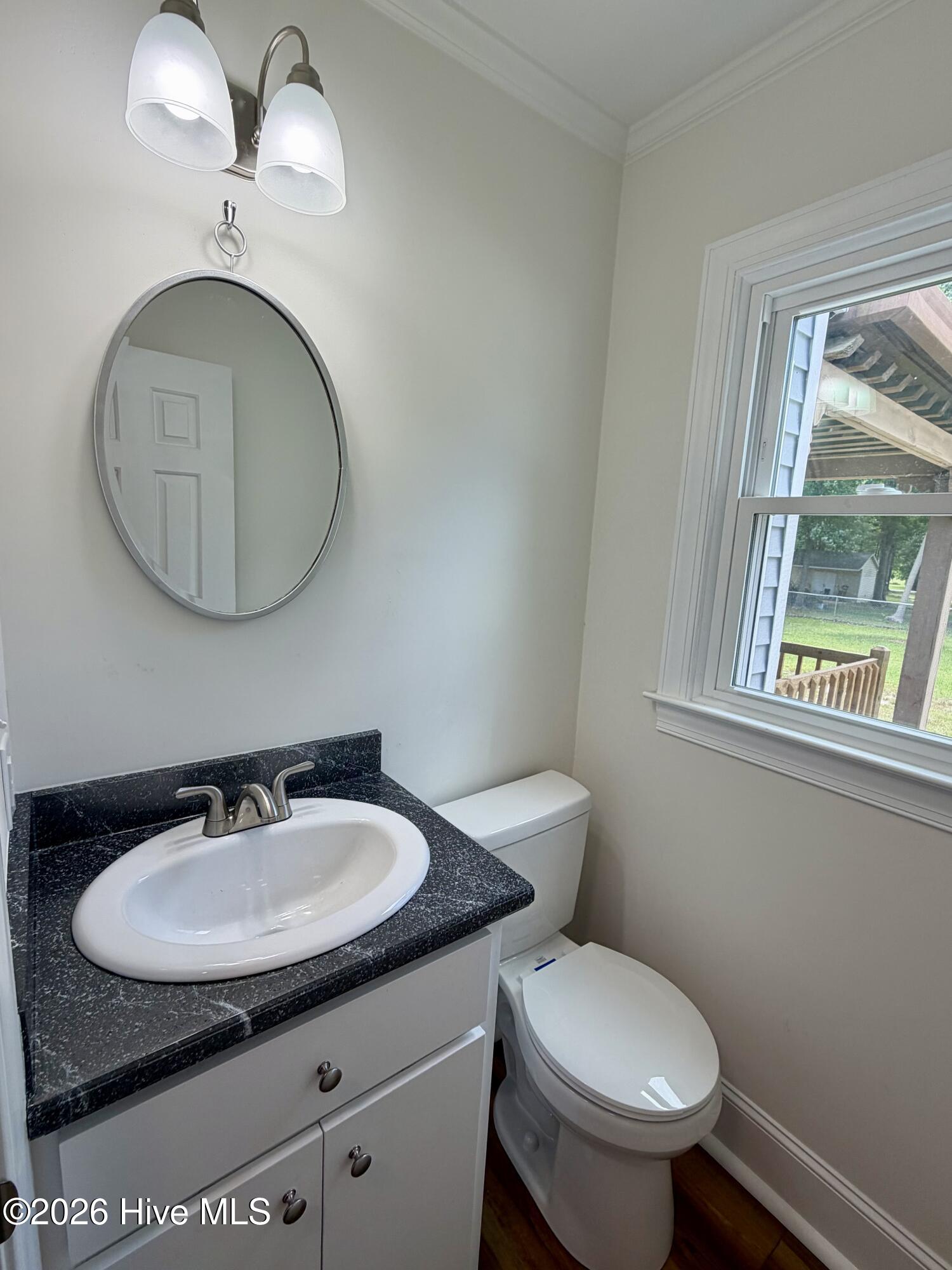 2443 Creekside Road Kinston, NC 28504 - Photo 28 of 60 Half bathroom located just off the kitchen features a new vanity, new countertops, new flooring, new windows!