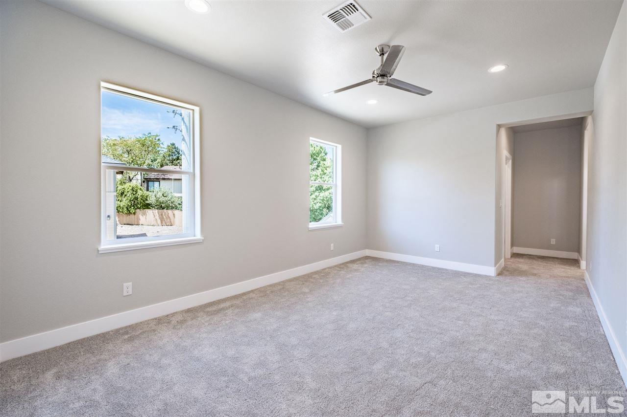 1605 Elizabeth Street Reno, NV 89509 - Photo 11 of 25 an empty room with windows and ceiling fan