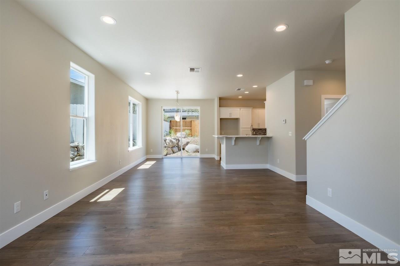 1605 Elizabeth Street Reno, NV 89509 - Photo 4 of 25 a view of an empty room with wooden floor and a window