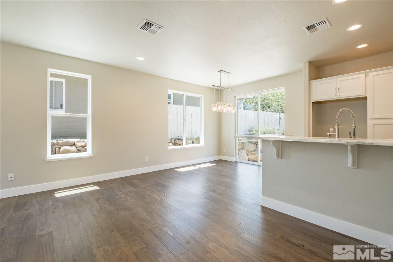 1605 Elizabeth Street Reno, NV 89509 - Photo 8 of 25 a view of an empty room with a window and wooden floor