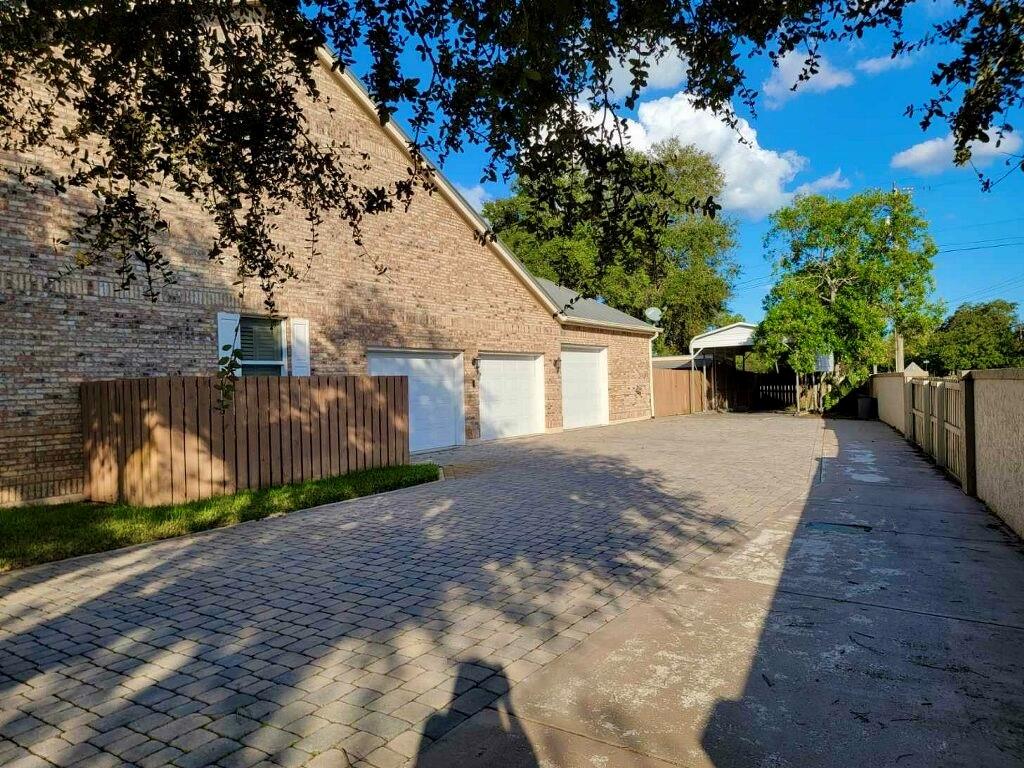 3110 Lost Tree Boulevard Fort Pierce, FL 34981 - Photo 4 of 6 3 car garage / 1 car port. Beautiful driveway - plenty of room.
