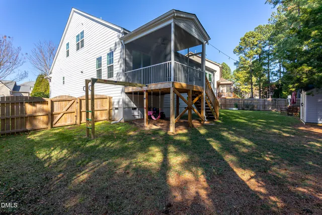 a patio with a yard table and chairs