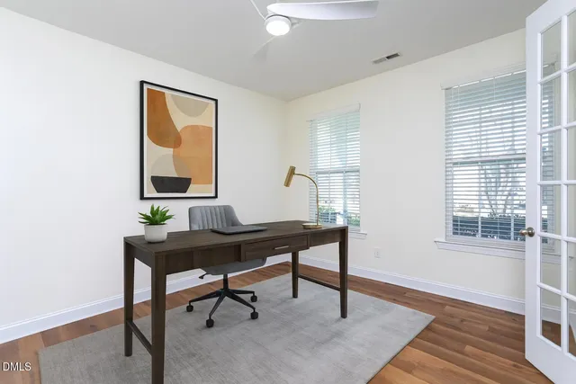 a view of a workspace with furniture