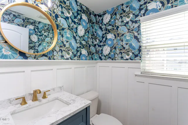 a bathroom with a toilet and a sink