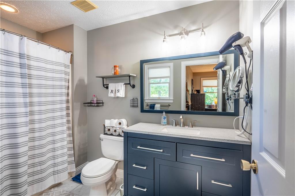 228 Country View Drive Lower Burrell, PA 15068 - Photo 18 of 49 a bathroom with a sink vanity mirror and toilet