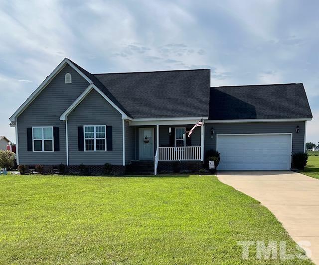 5333 Needham Road Bailey, NC 27807 - Photo 1 of 20 a view of a house with a yard and garage