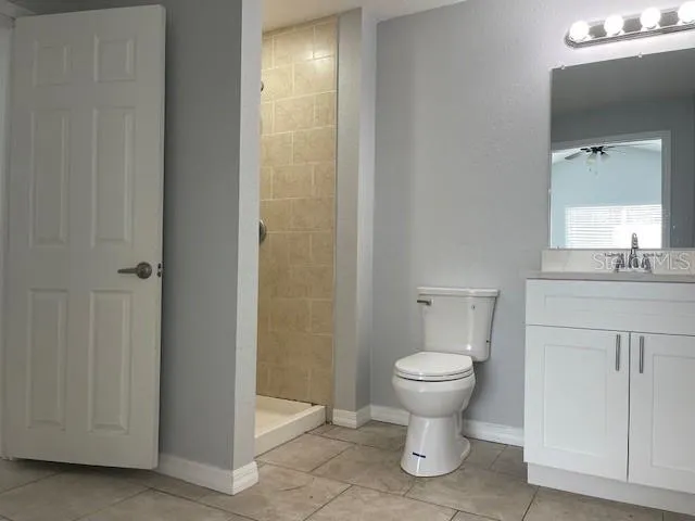 a bathroom with a toilet sink and a mirror