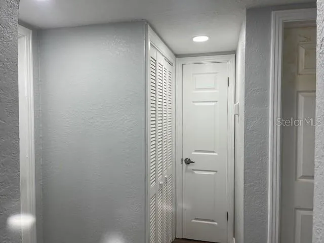 a bathroom with a shower and a sink