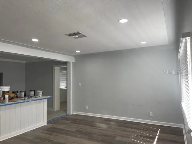a view of a hallway with a kitchen