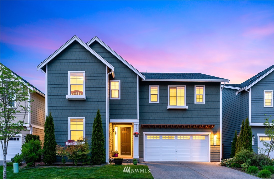 a front view of a house with yard