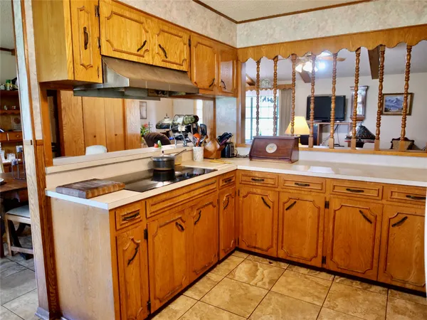 a kitchen with stainless steel appliances granite countertop a sink and cabinets