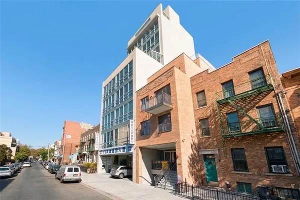 a view of a street with buildings