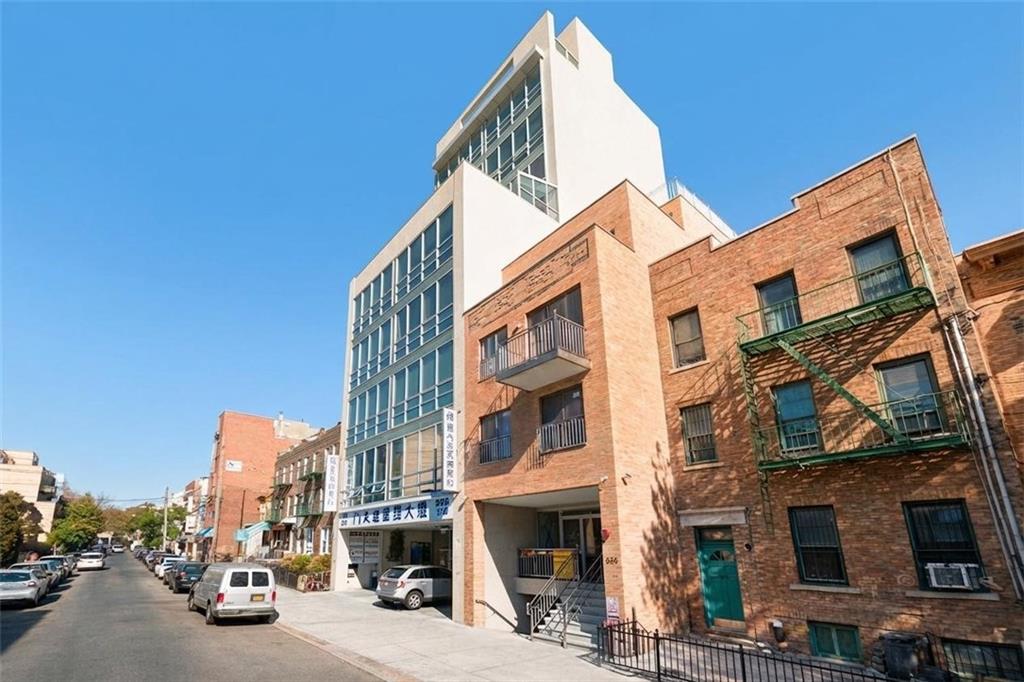 a view of a street with buildings