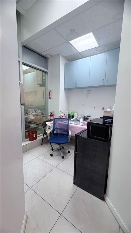 849 57th Street, Unit 101 Brooklyn, NY 11220 - Photo 7 of 14 a room with furniture and a gate