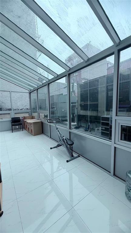 849 57th Street, Unit 101 Brooklyn, NY 11220 - Photo 9 of 14 a view of a room with gym equipment