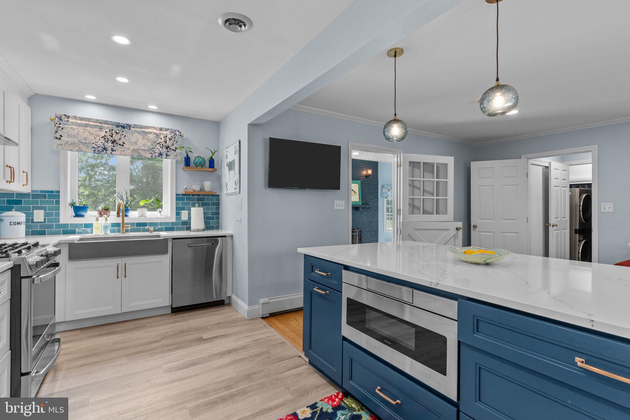 410 Island Road Columbus, NJ 08022 - Photo 15 of 43 a kitchen with a stove and a wooden floor