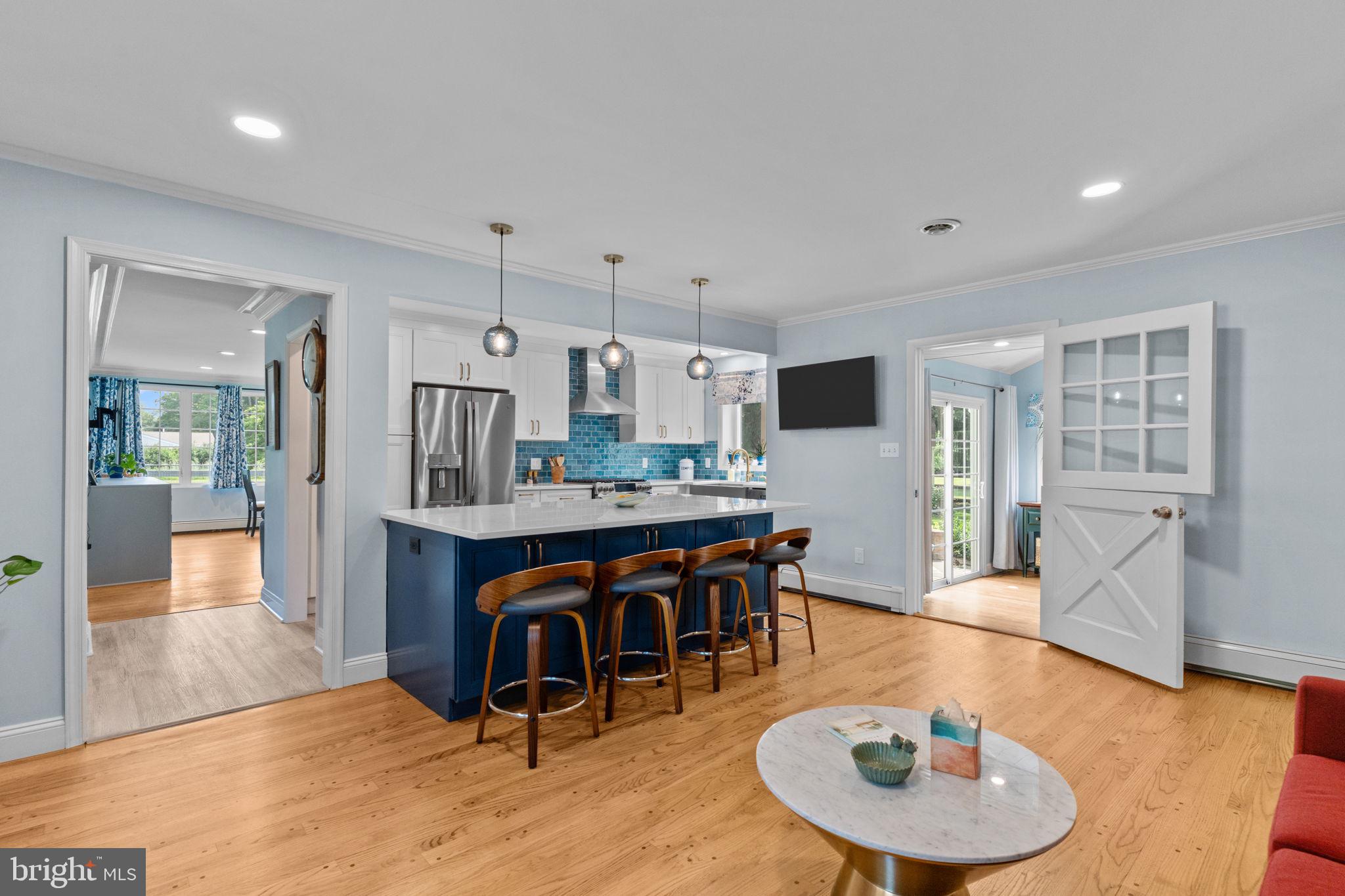 410 Island Road Columbus, NJ 08022 - Photo 18 of 43 a room with stainless steel appliances kitchen island granite countertop a dining table and chairs with wooden floor