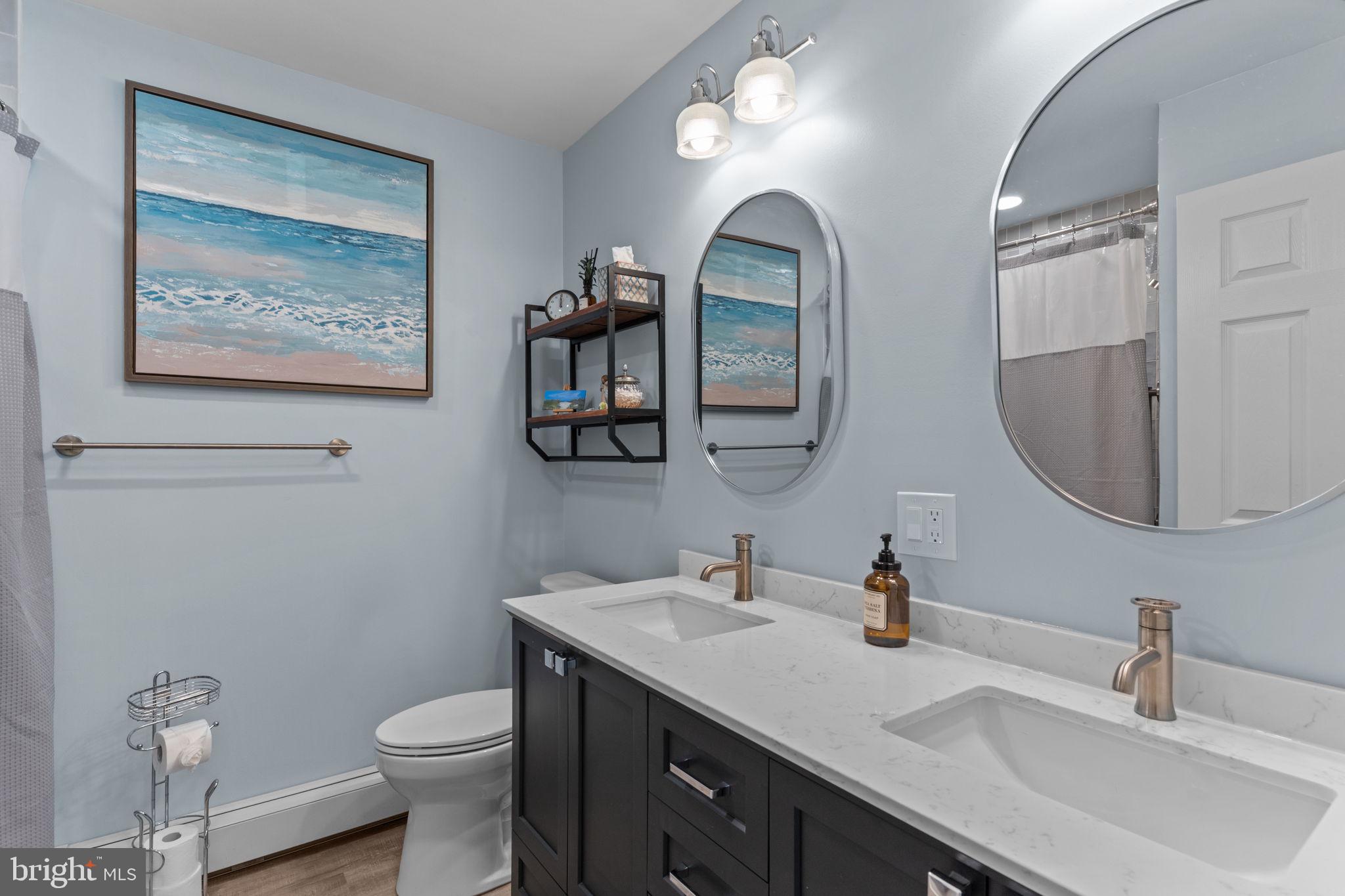410 Island Road Columbus, NJ 08022 - Photo 27 of 43 a bathroom with a toilet a sink and mirror