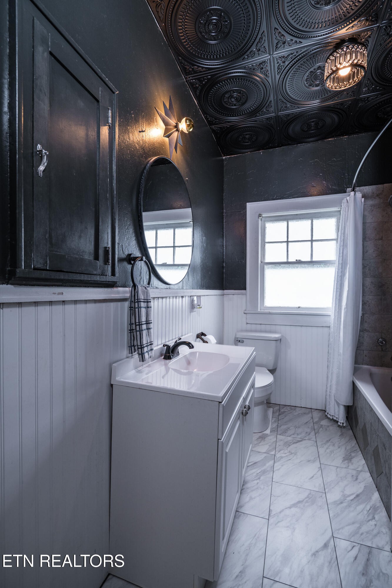 341 Church Street Spring City, TN 37381 - Photo 25 of 37 a bathroom with a sink a mirror and a bathtub