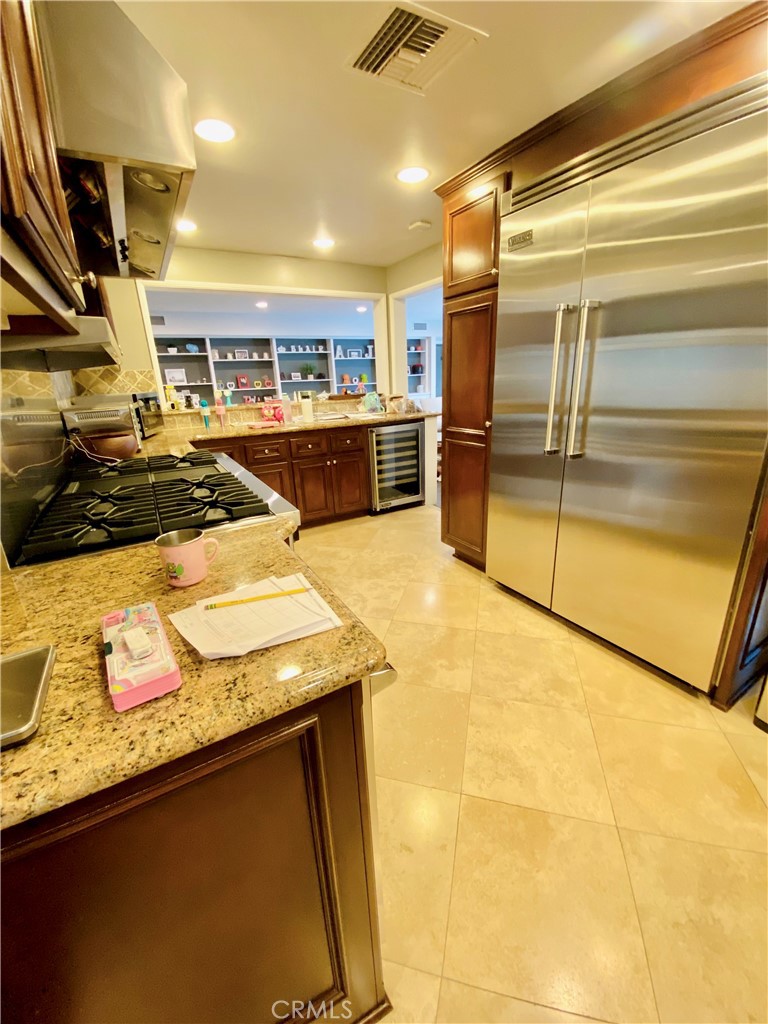 3187 Sunnyslope Boulevard Pasadena, CA 91107 - Photo 13 of 15 a kitchen with stainless steel appliances granite countertop a sink and a stove