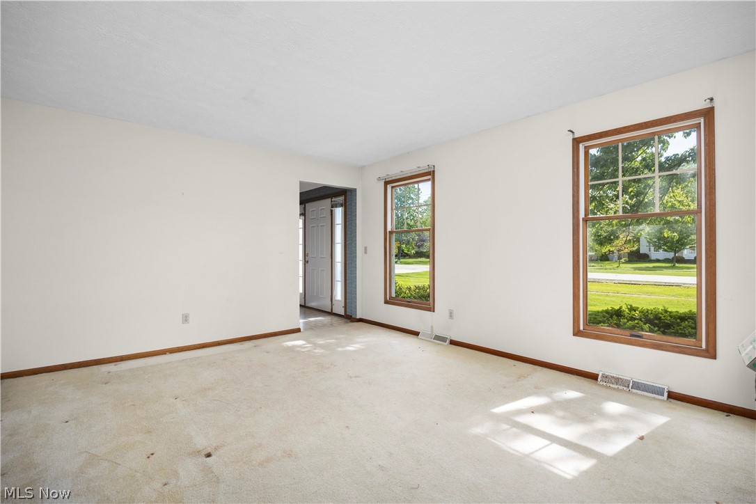 722 Jaycox Road Avon Lake, OH 44012 - Photo 14 of 48 Living area with two large windows featuring wood-finish trim