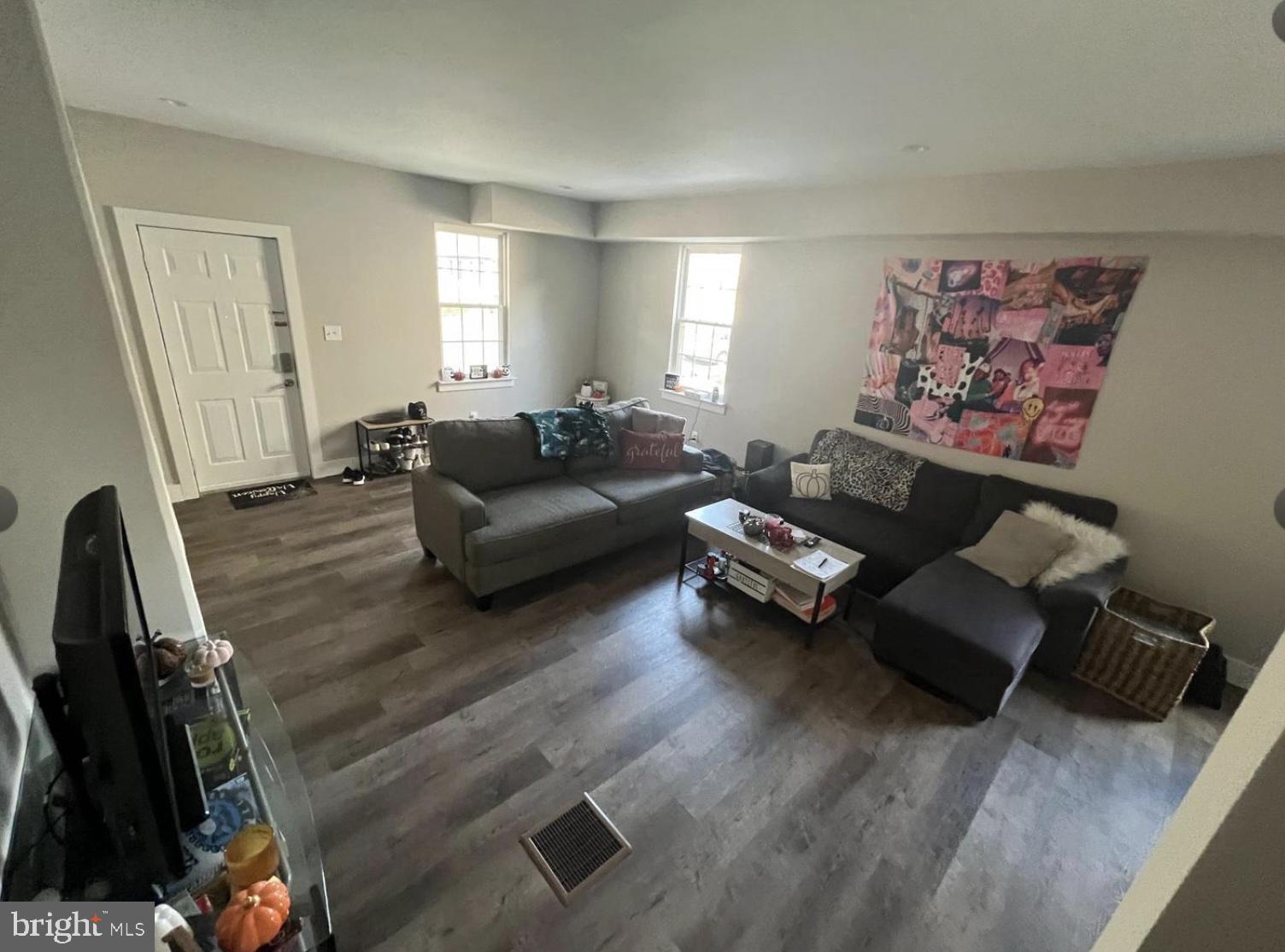 28 Zane Street, Unit 28 Glassboro, NJ 08028 - Photo 2 of 10 a living room with furniture and a window