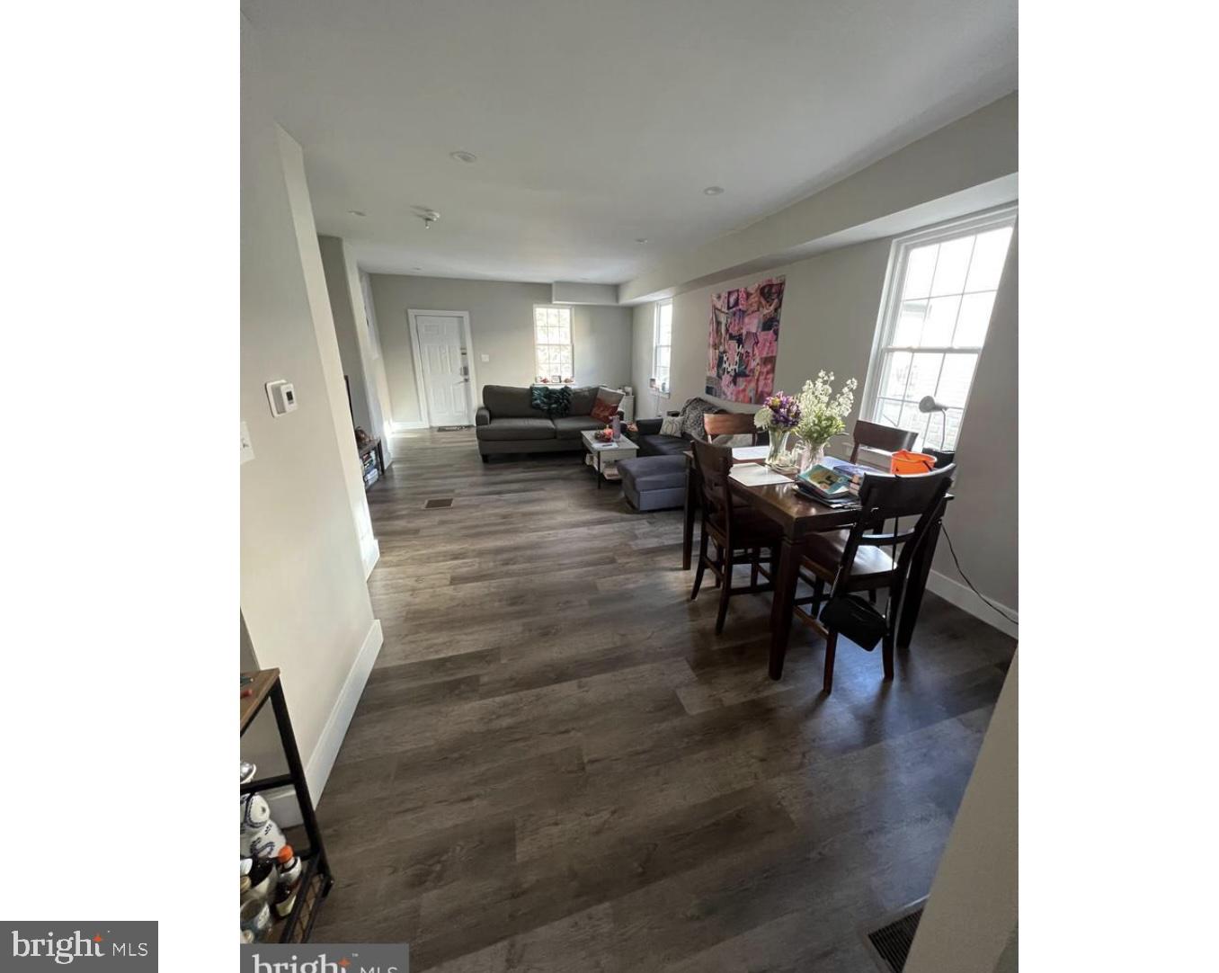 28 Zane Street, Unit 28 Glassboro, NJ 08028 - Photo 3 of 10 a living room with furniture and a dining table