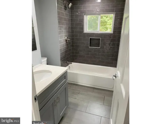 a bathroom with a sink and a bathtub