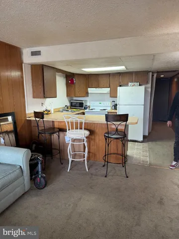 a view of a livingroom with furniture and window