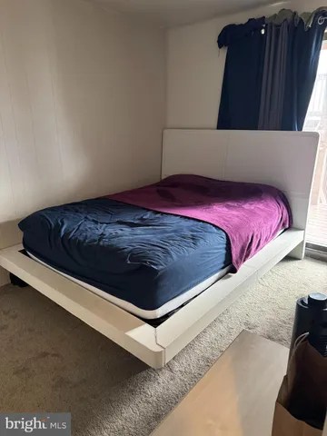 a living room with a couch and a rug