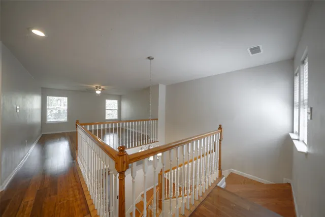 a view of an entryway wooden floor and windows
