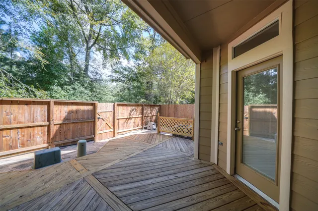a view of a balcony with wooden floor