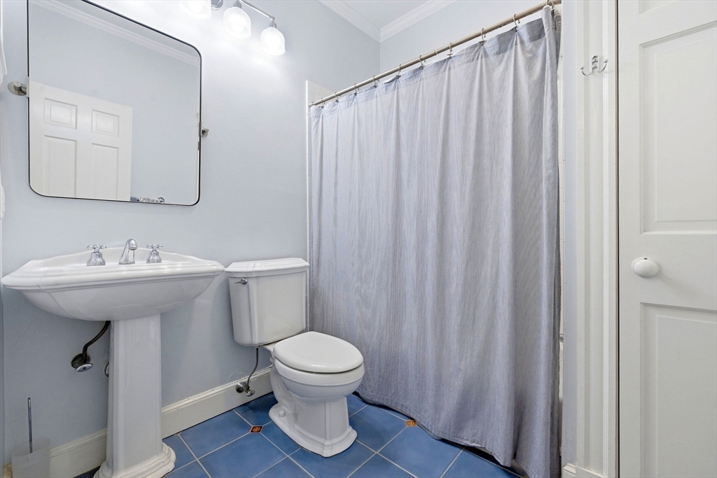 35 High Street, Unit 1 Boston, MA 02129 - Photo 13 of 33 a bathroom with a sink a toilet and a mirror
