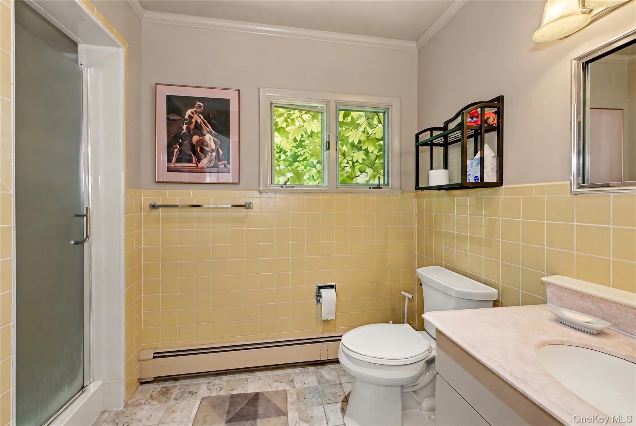 631 Croton Falls Road Carmel, NY 10512 - Photo 28 of 43 a white toilet sitting next to a bathroom and a window